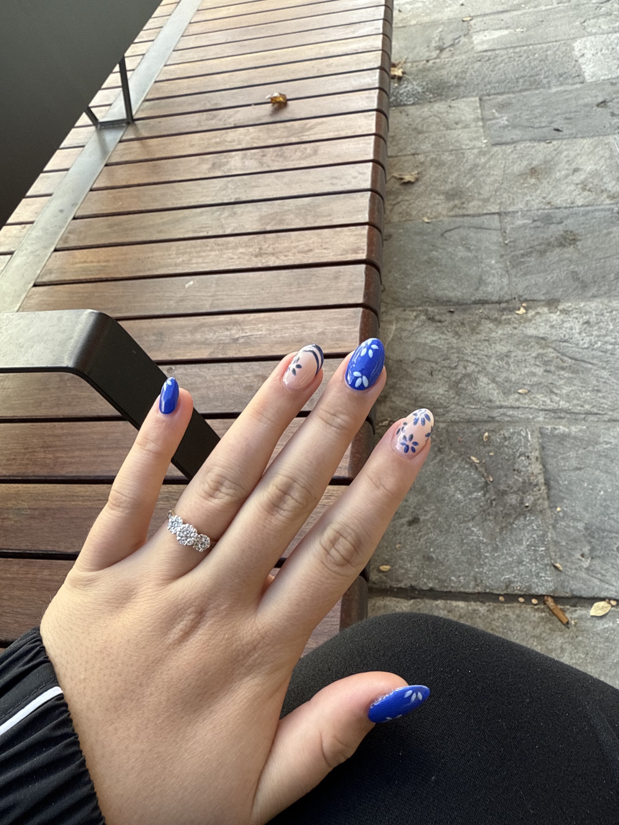 Cobalt blue nails with small white painted flowers